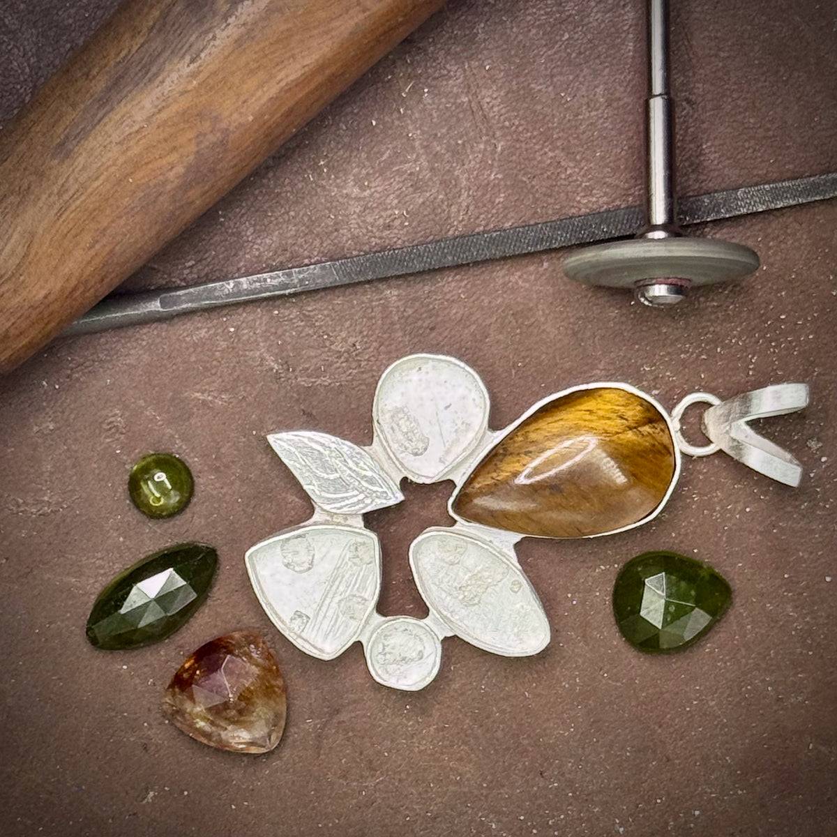 Making the pendant, setting stones and the tools used to complete the necklace